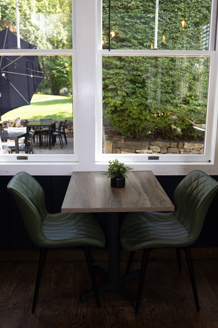 Cozy window table inside Brew Cafe and Bistro